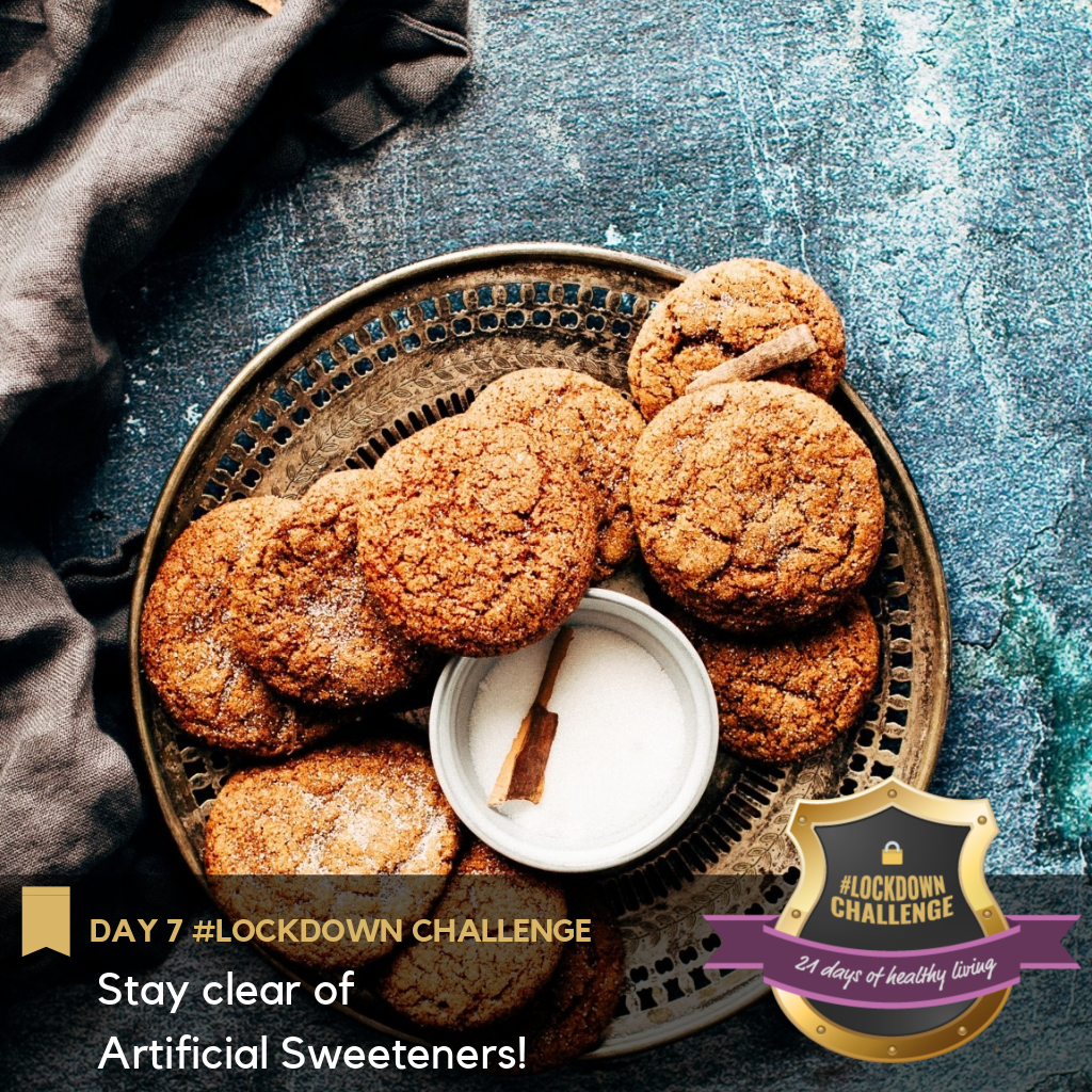 cookies lying in a plate with a small bowl of sugar