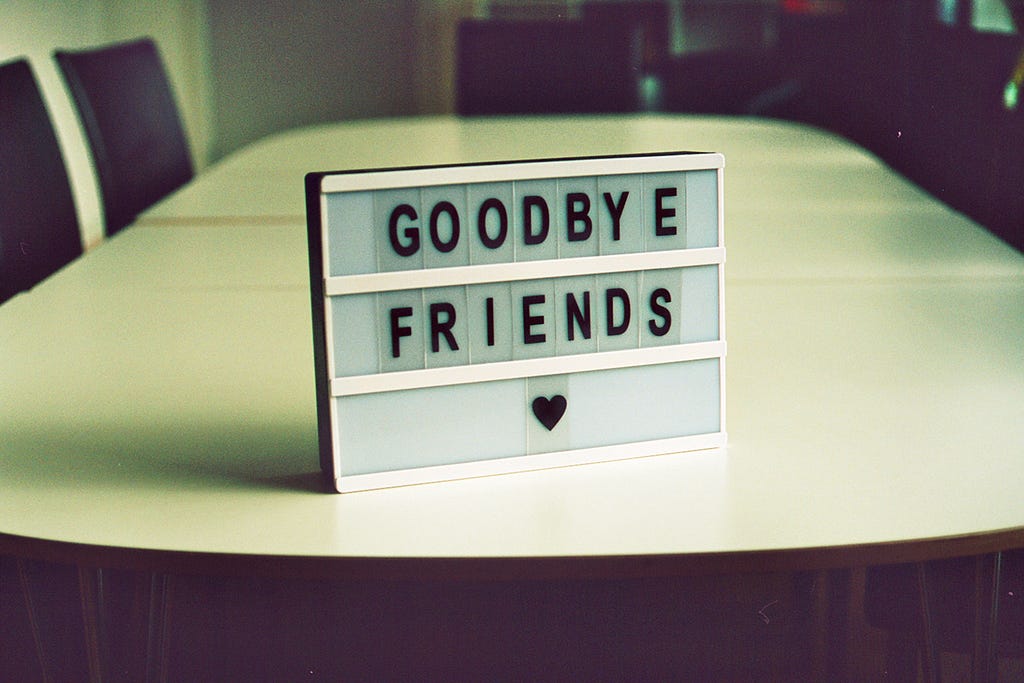 Image of a photobox on a table with the words “goodbye friends” and a heart symbol