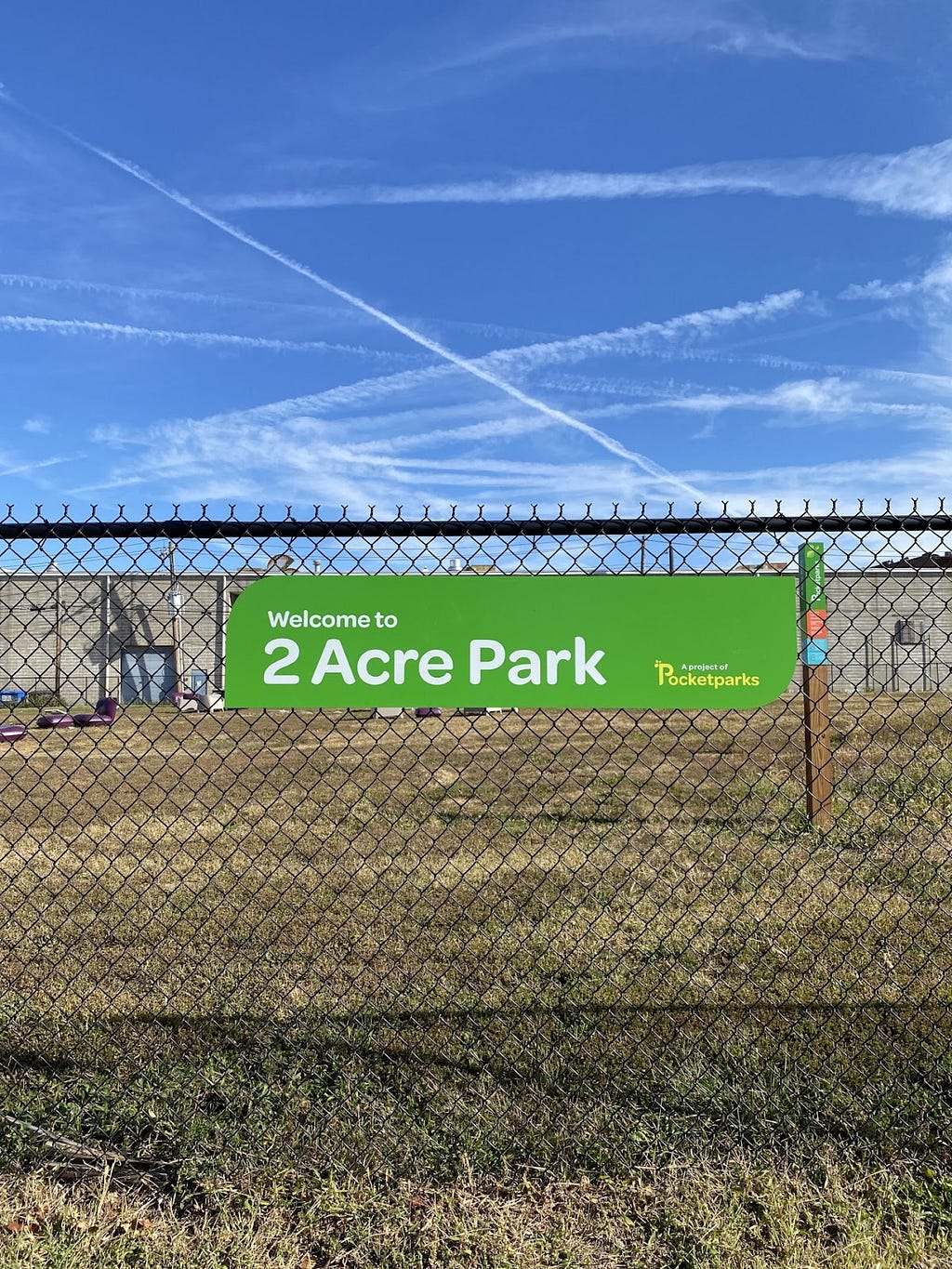 The front sign of 2 Acre Park, green