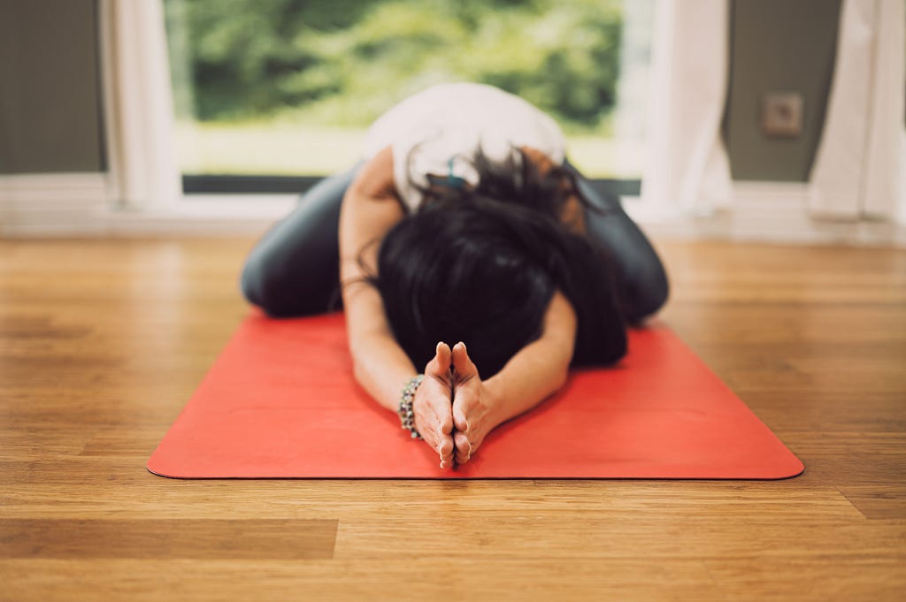 Woman in Childs pose 