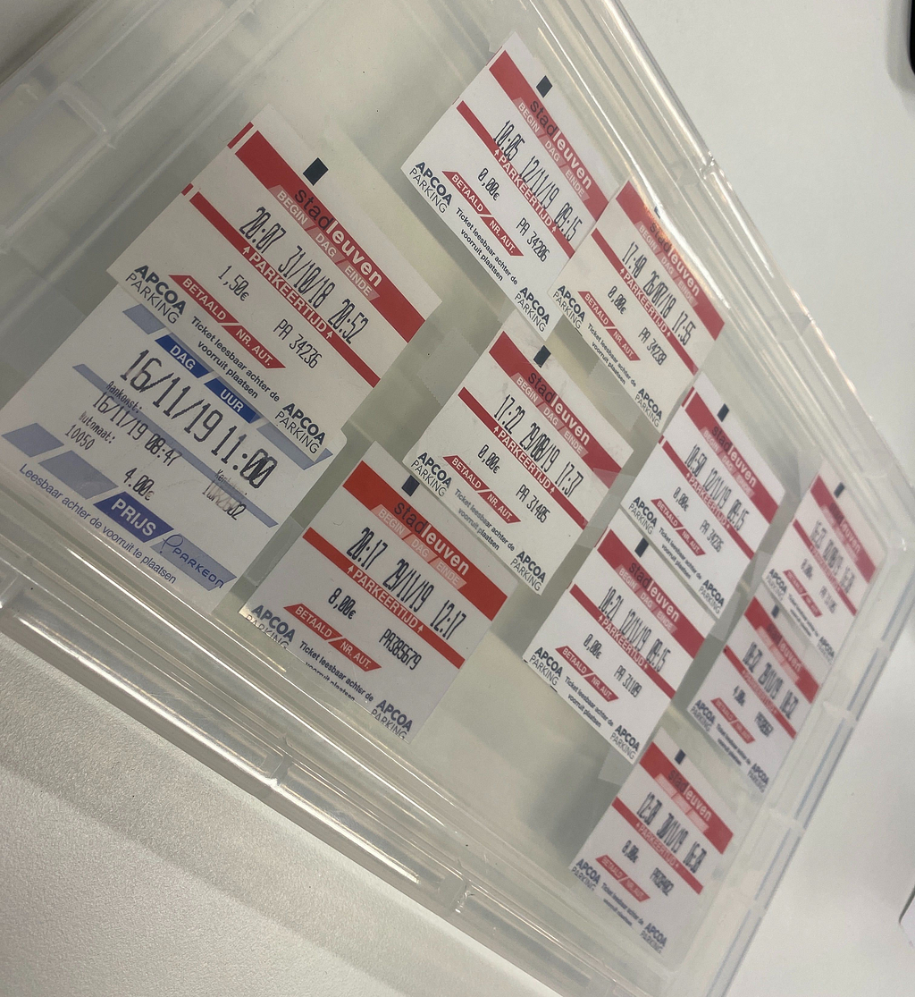 Some parking tickets stuck to a transparent plastic lid