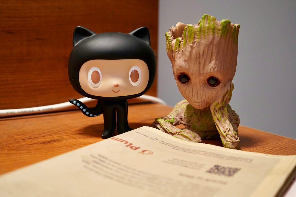 don’t know why this picture showed up on Unsplash, since my search term was Git. The picture shows Groot and Octocat reading a newspaper