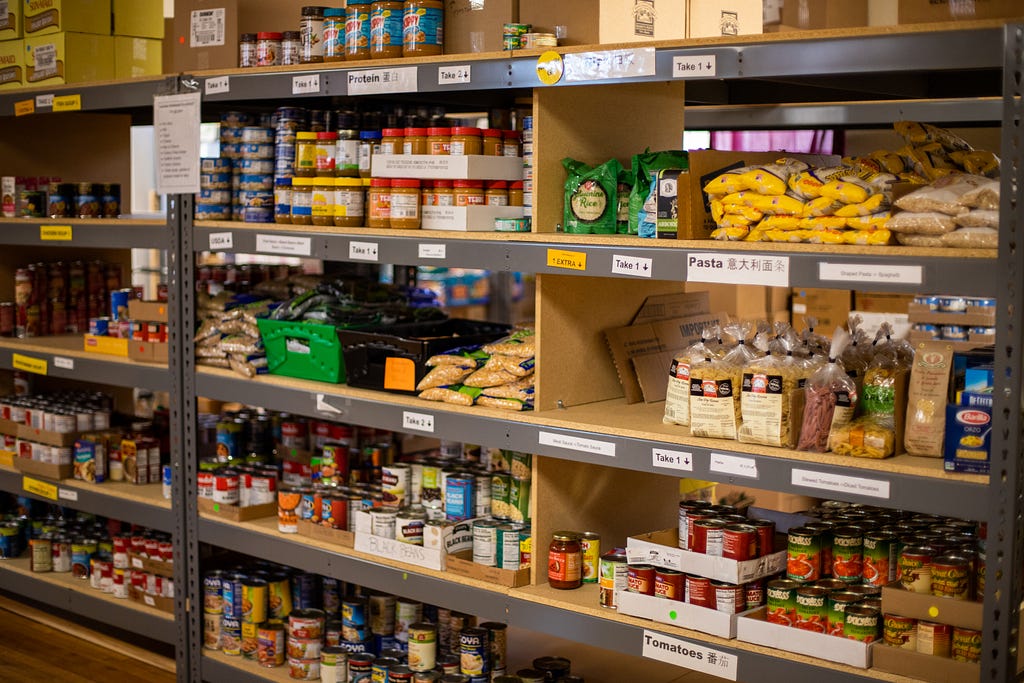 Shelving in a store cupboard packed with non-perishable foods
