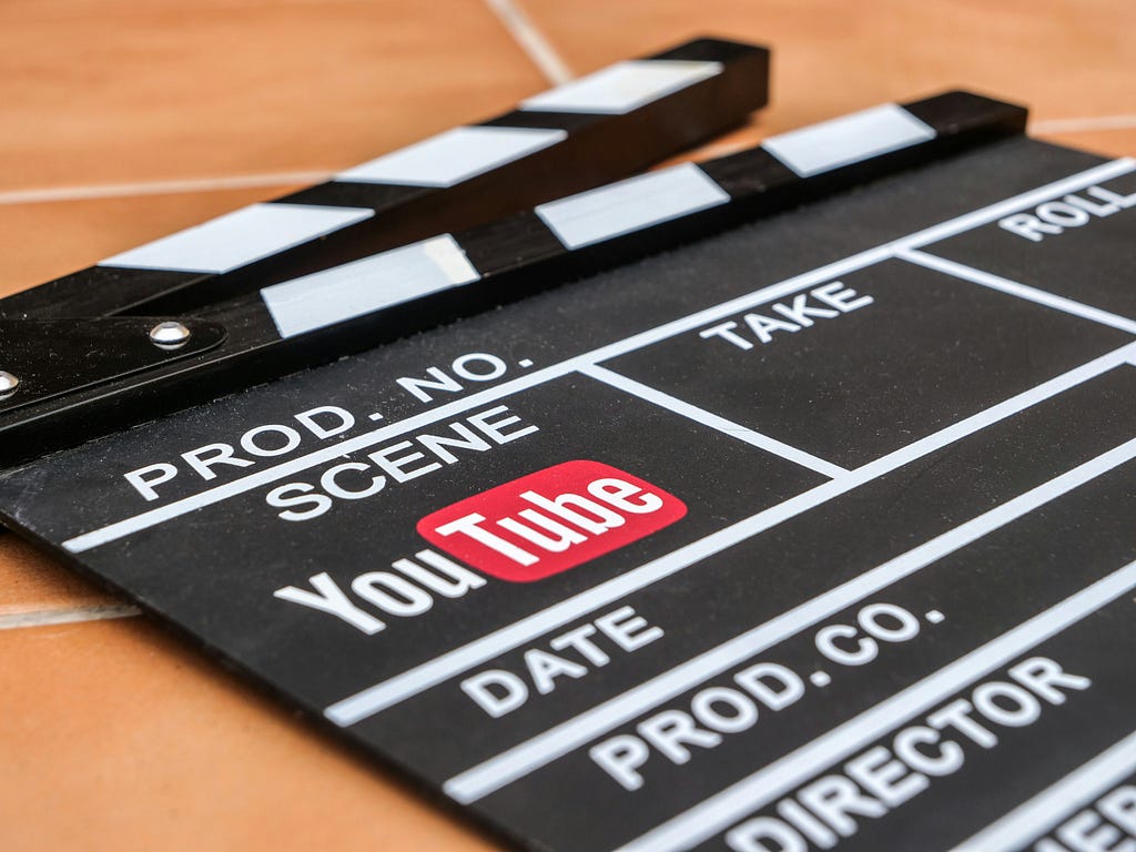 A clapperboard for a YouTube video