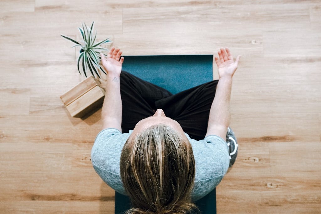 Woman seen from above, meditating