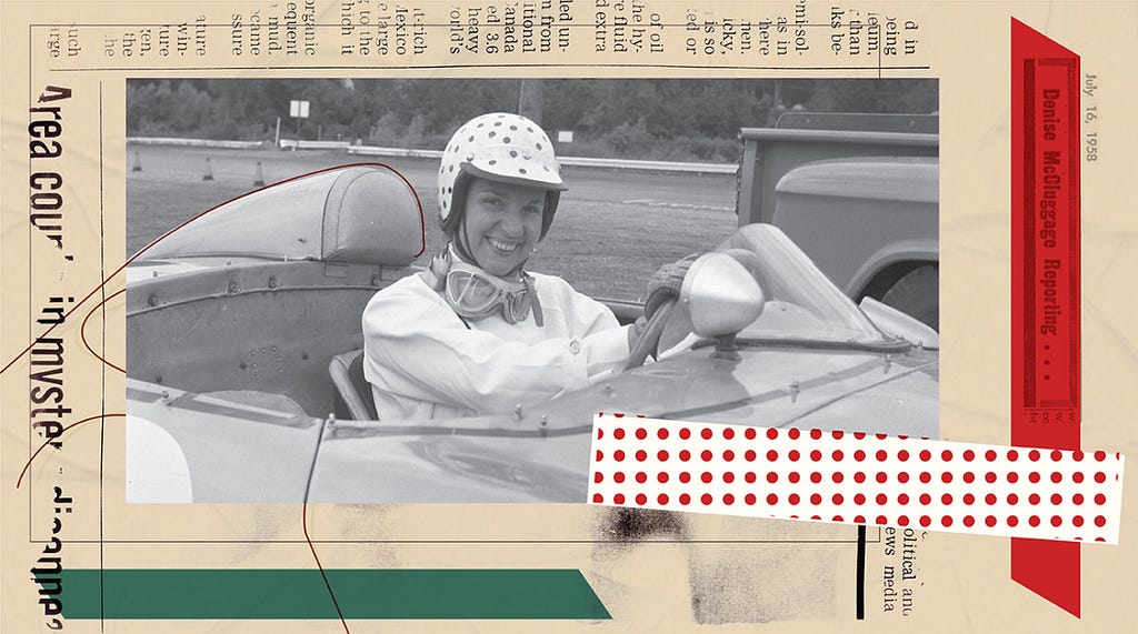 A black-and-white photo of a woman wearing a polka-dot helmet, with facing goggles around her neck, smiling from the driver’s seat of a racecar.