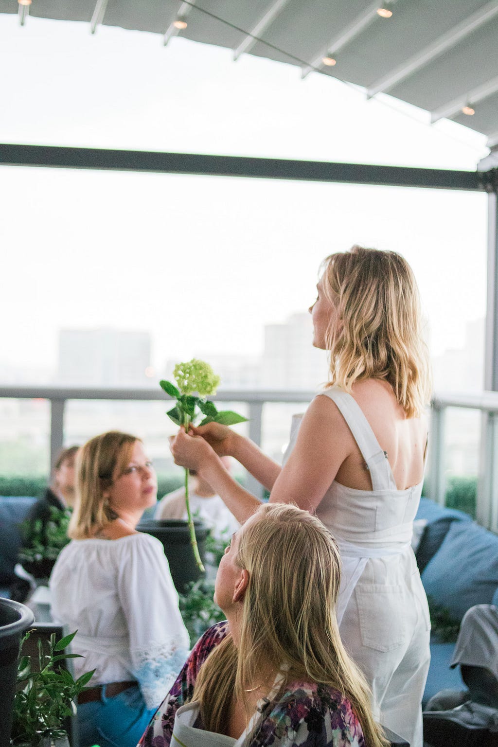 Nicole Spencer teaching women about hydrangeas during Alice's Table workshop in Jacksonville, Florida