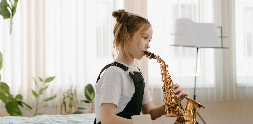 girl playing saxophone