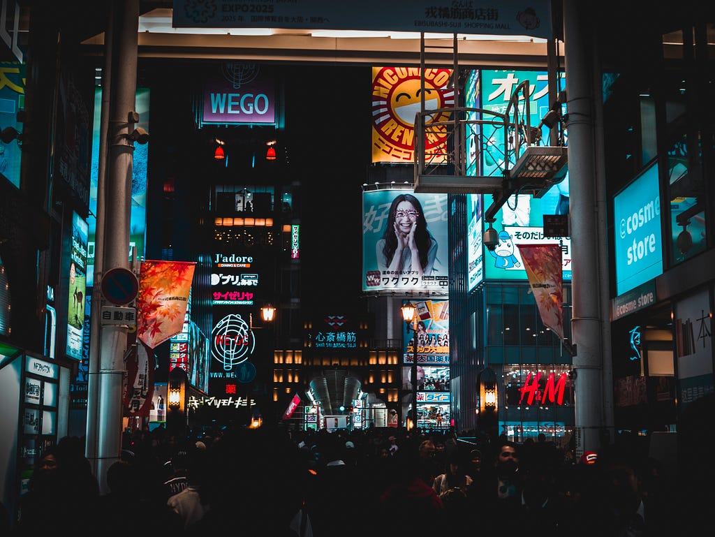 Electronic billboards featuring advertising in a cityscape