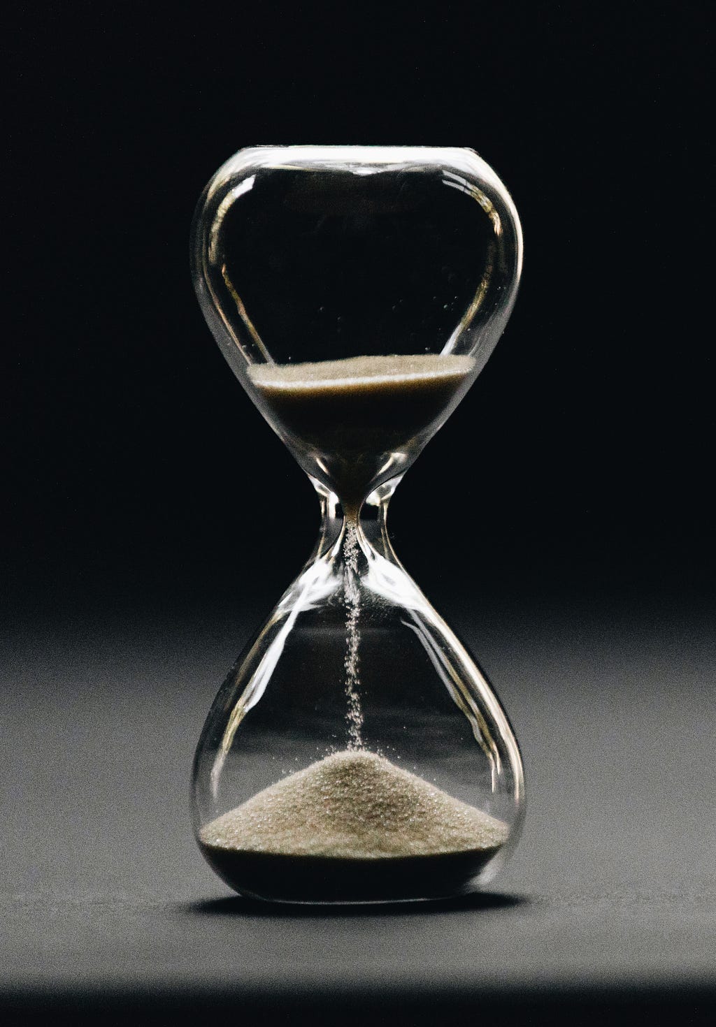 An hour-glass in motion for time management