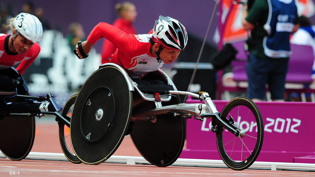 A female para-athlete using a wheelchair in a Paralympic wheelchair race. Source: https://www.nippon-foundation.or.jp/en/what