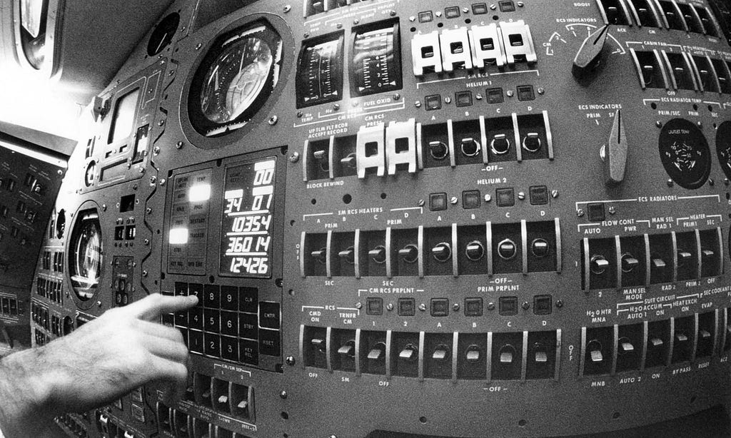 Entering commands into the Display and Keyboard (DSKY) of the Apollo Guidance Computer during a simulation. Image courtesy: Draper.