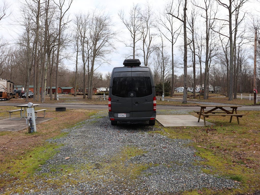 The camper van parked at a campground.