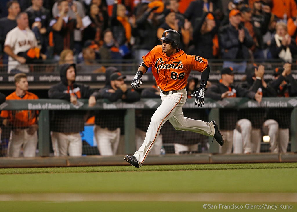 Gorkys Hernandez scores on a single hit by Buster Posey in the first inning.