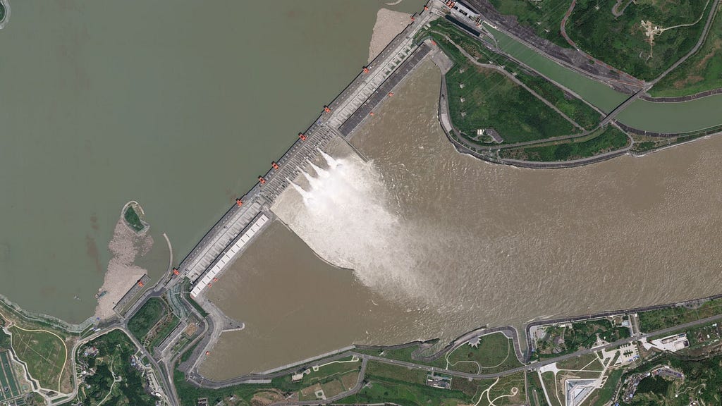 satellite imagery showing four floodgates open at the Three Gorges Dam