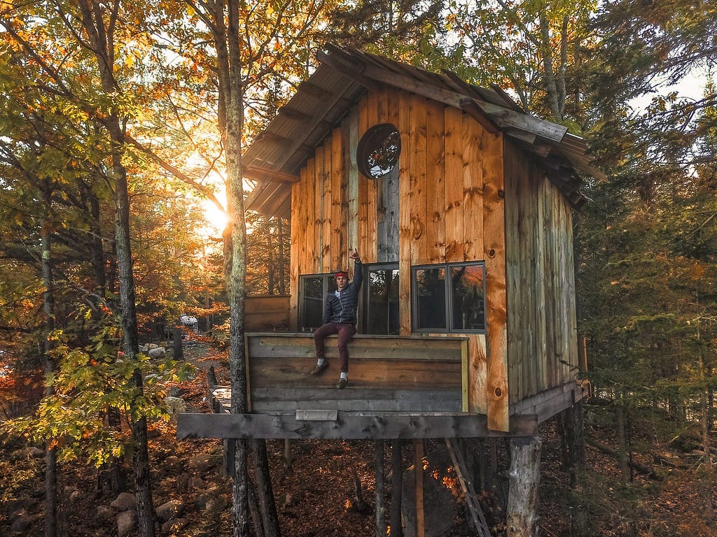 Abitz outside a treehouse.