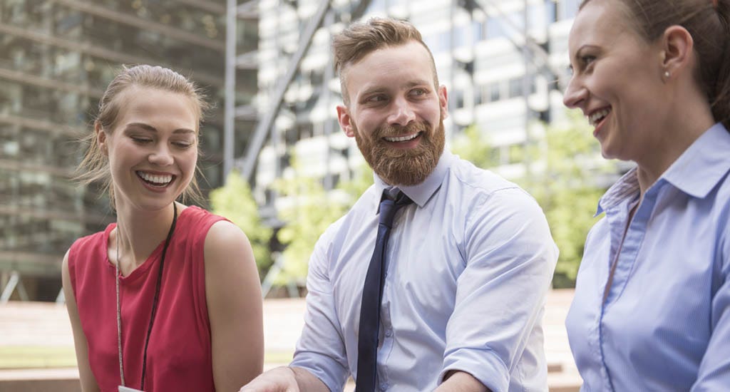 Team leader having personal discussion with coworkers