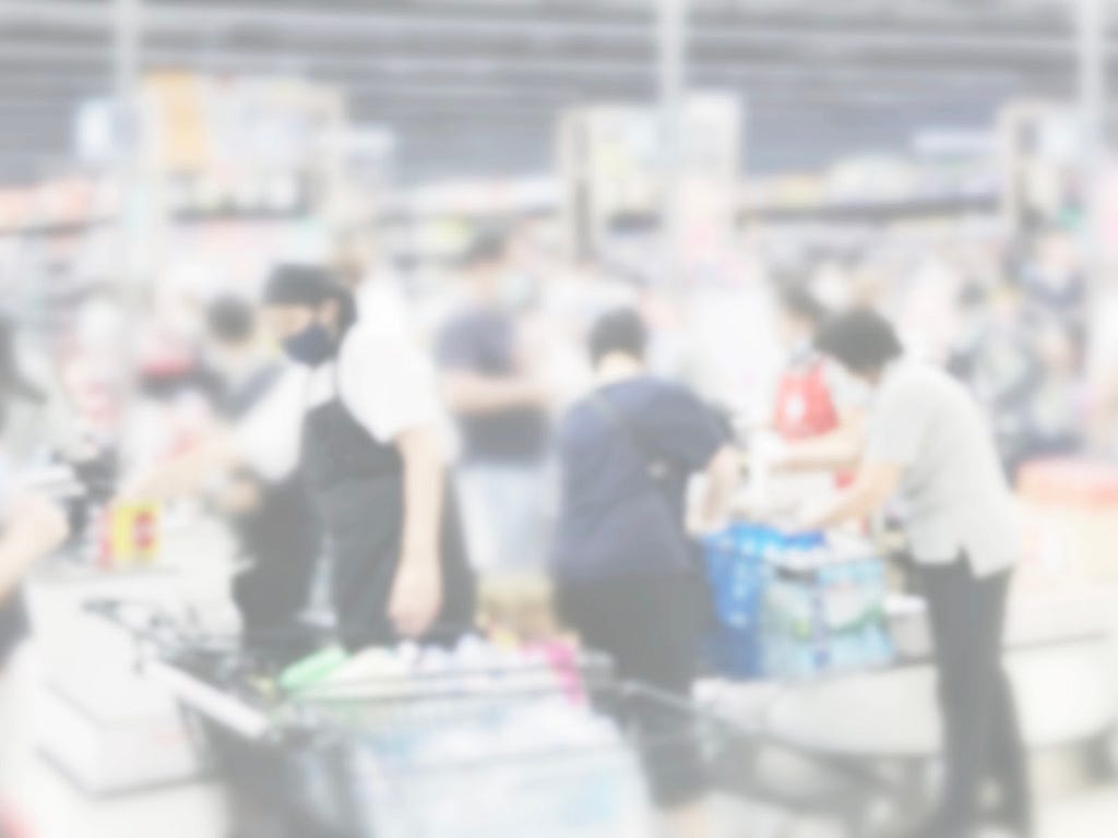 blurred image of a factory line of works and products