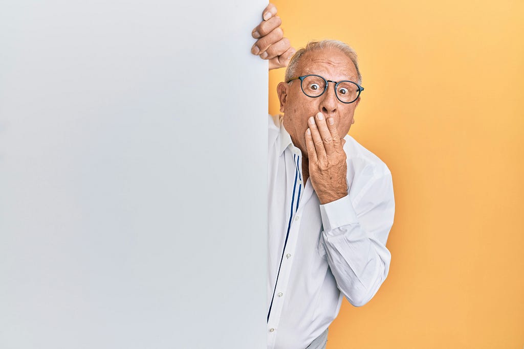 An old man wearing a surprise face