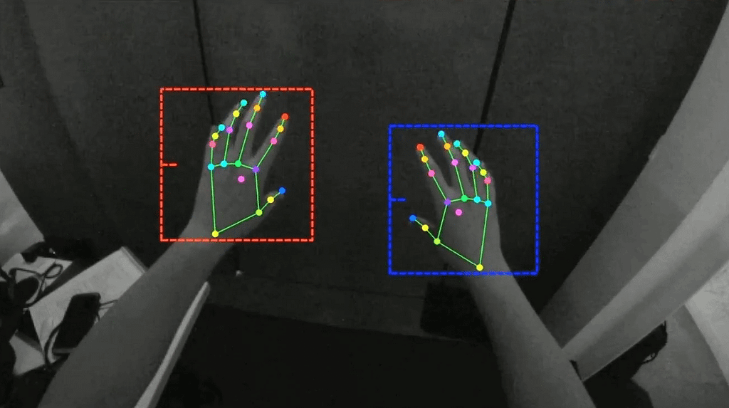 Computer image of hands with tracking marks on fingers