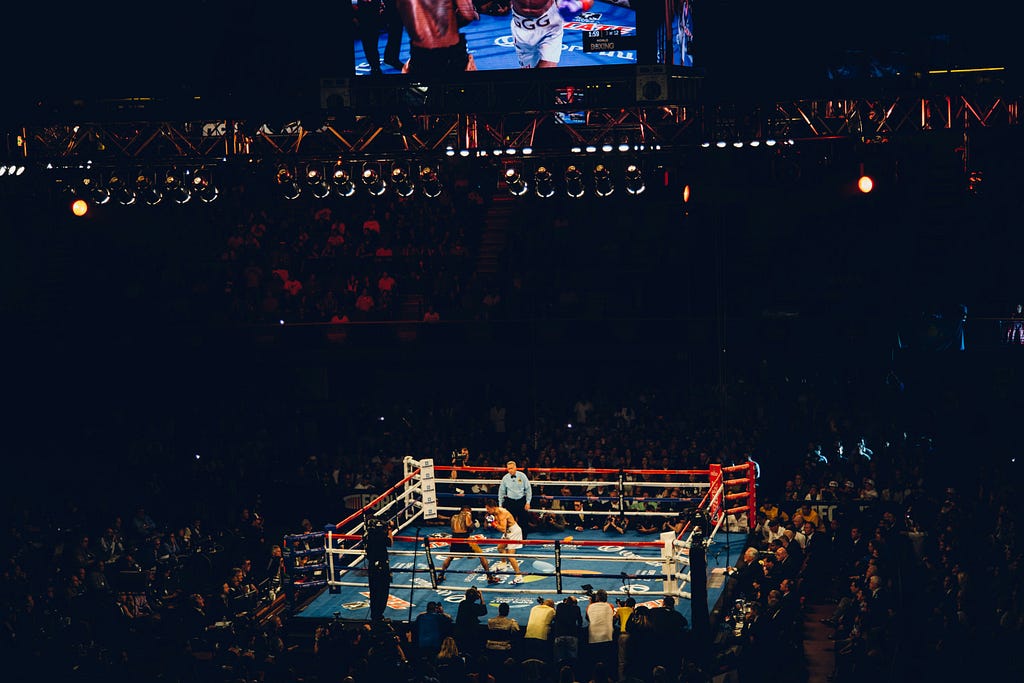 well-lit boxing ring from afar