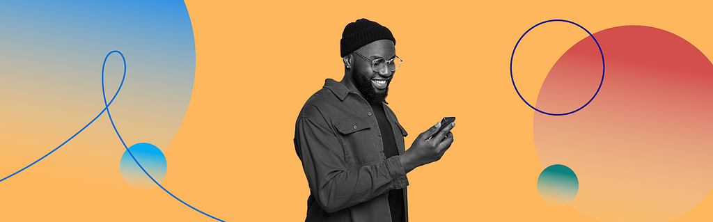 Black and white photo of man looking at cell phone, surrounded by colorful design with circles and lines.