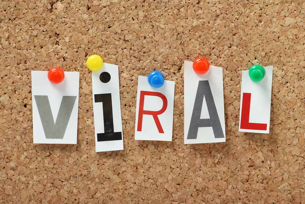 A corkboard with the word ‘VIRAL’ pinned to it. This image is related to the concept of ‘Viral Doesn’t Equal Valuable,’ which highlights the potential downsides of chasing viral fame in marketing.