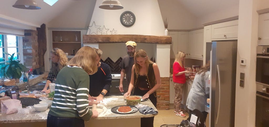 The CAST team creating pizzas for dinner