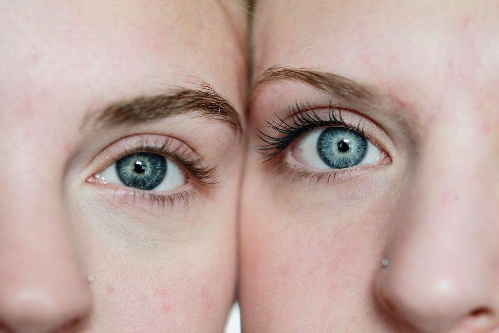 Faces of two women with green eyes next to each other.
