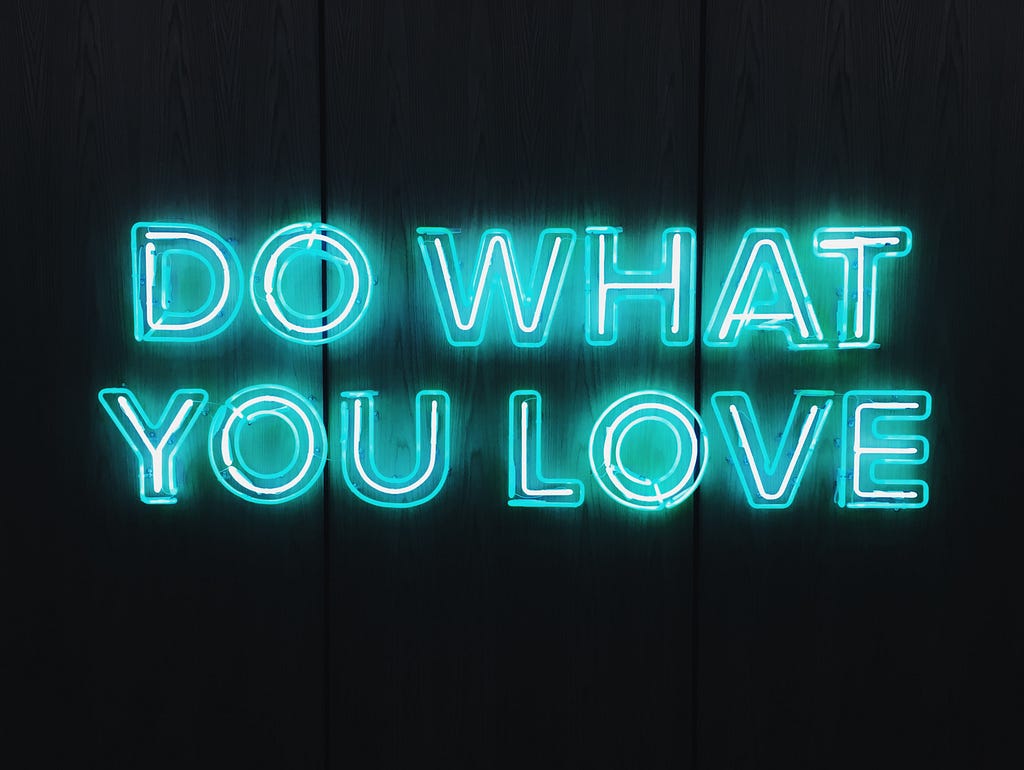 Neon sign that says: “Do what you love”