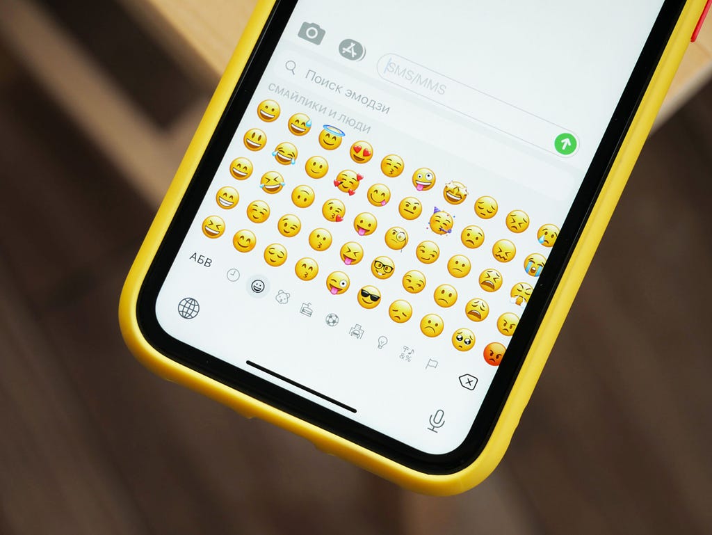 Emoji keyboard showing different emojis on mobile phones