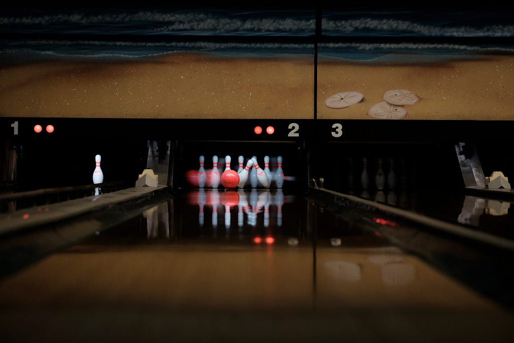 Tenpin bowling in the dark, by the looks of it.