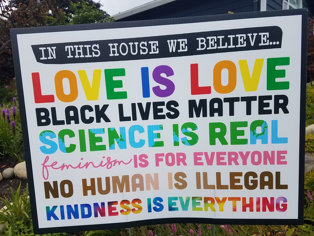 A banner with multiple messages like: love is love, black lives matter, kindness is everything.