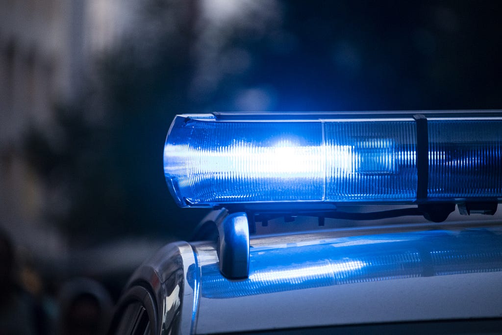 Close up of police car flashing blue light
