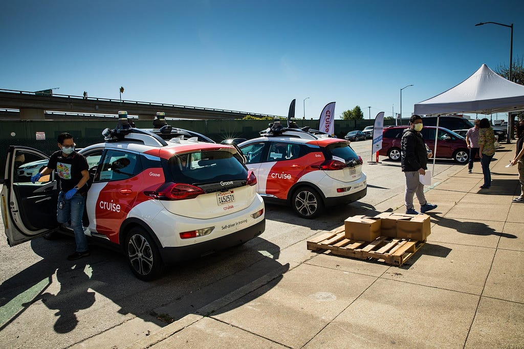 Cruise volunteers their all-electric, self-driving fleet to deliver meals and groceries in San Francisco.