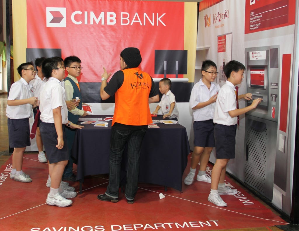 Finance is fun: Children making and completing bank transactions at CIMB Bank Berhad