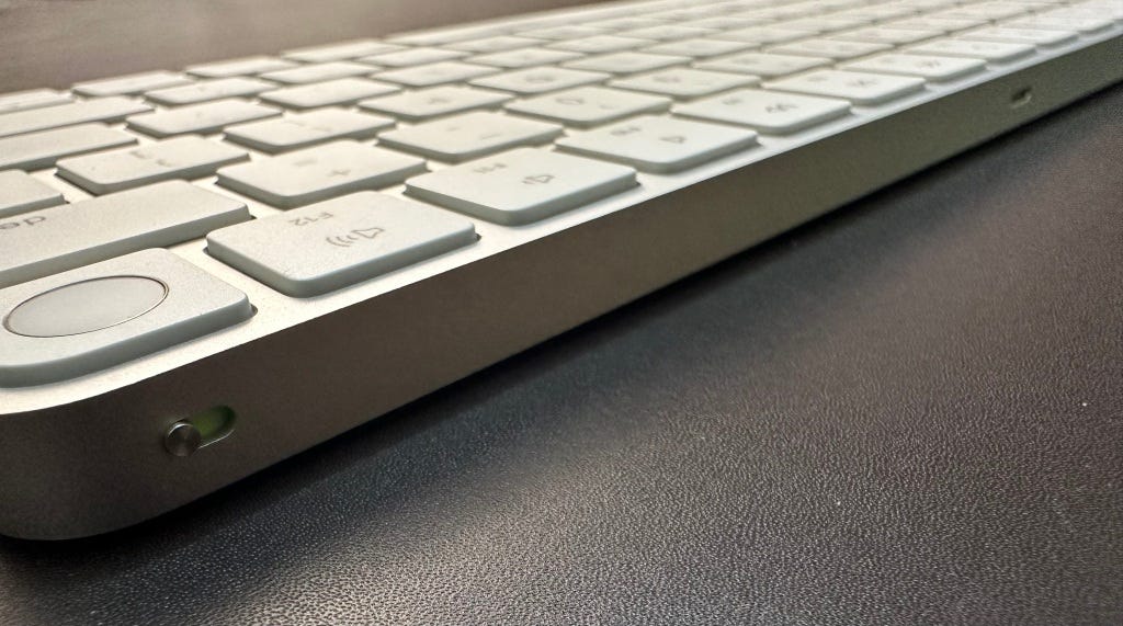 Rear shot of Apple Magic Keyboard with Touch ID showing toggle switch and lightning port