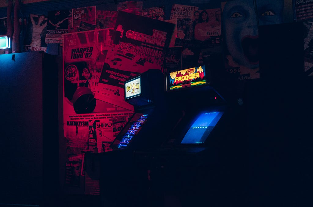 A neon glow with Arcade cabinets.