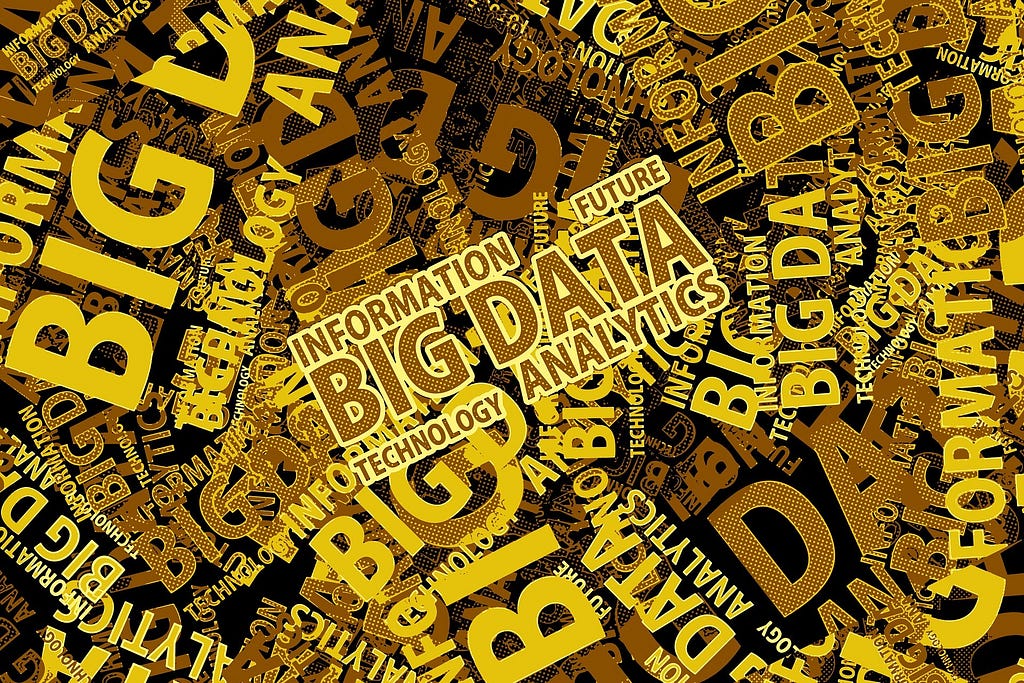 A canvas with the the words “Big Data,” “Analytics,” “Information,” and “Technology” written in brown and yellow