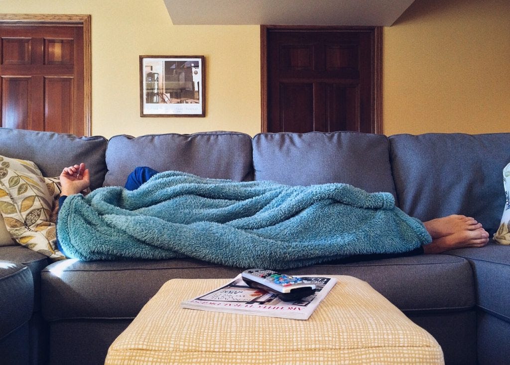 couchsurfing-man-sleeping-on-coouch