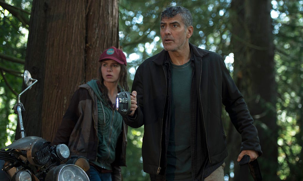 Disney's TOMORROWLAND L to R: Casey (Britt Robertson) and Frank (George Clooney) Ph: Kimberley French ©Disney 2015