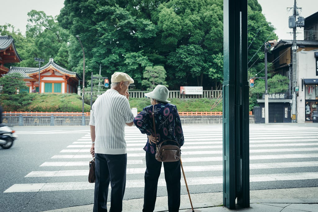 photo of an elderly man and a woman