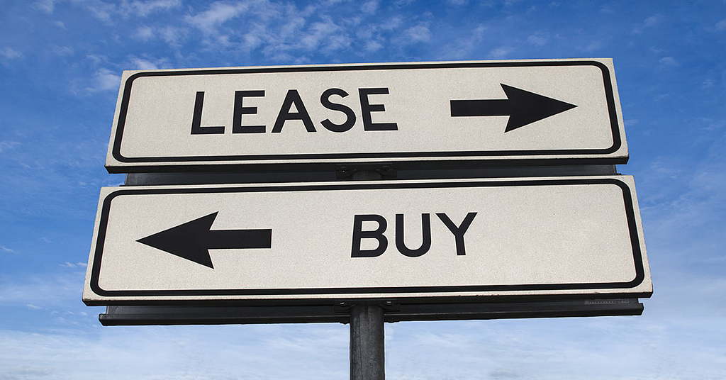 a sign indicating the direction of leasing and purchase