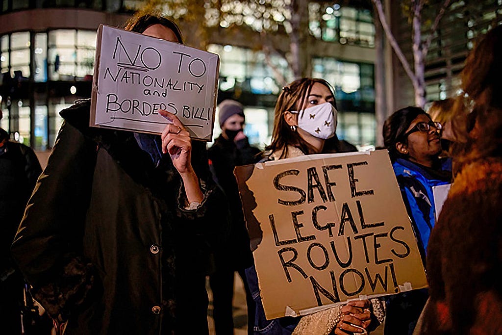 LONDON, UNITED KINGDOM — 2021/11/25: A protester is seen holding a placard expressing her opinion, during the demonstration. People gathered outside the Home Office in London to protest against the Nationality and Border Bill and its implications to the refugees in response to the recent channel deaths. (Photo by Hesther Ng/SOPA Images/LightRocket via Getty Images)