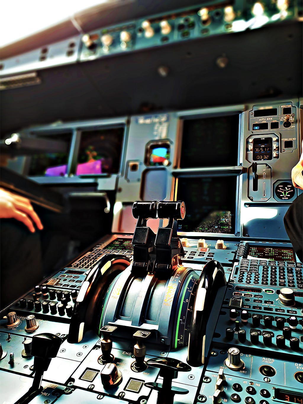 Flight deck of a passenger aircraft displaying complex set of controls.