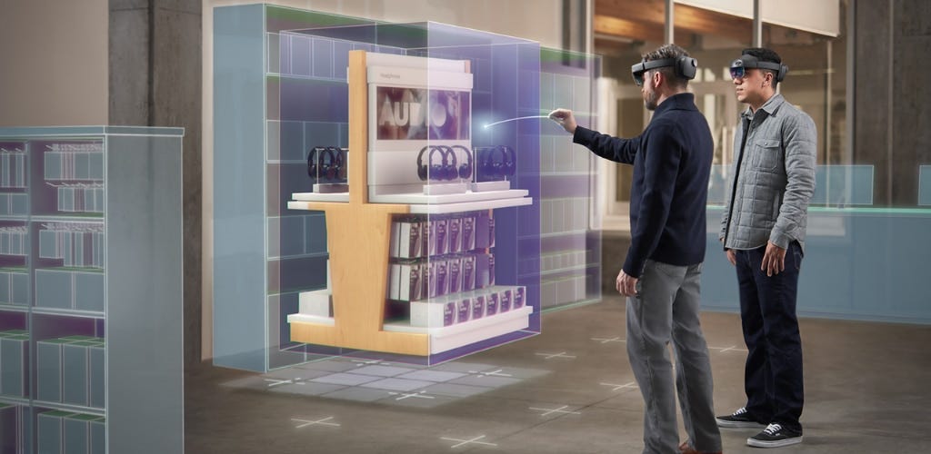 “Point and commit with hands on HoloLens 2.” Image and alt text by Microsoft. Original image located here: https://learn.microsoft.com/en-us/windows/mixed-reality/discover/mixed-reality