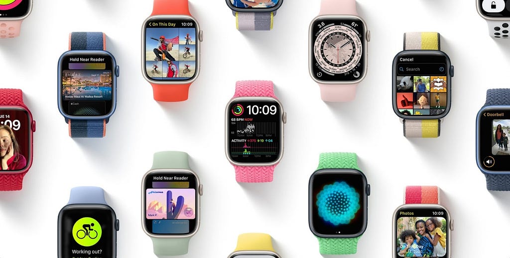 Flat lay of many smart watched in different colors showing different apps.