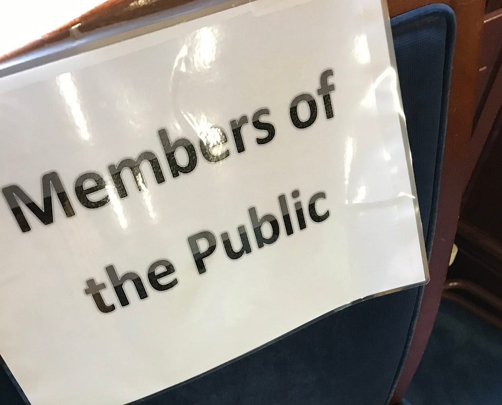A sign at the council chamber, anointing this chair as the designated seating area for Members Of The Public