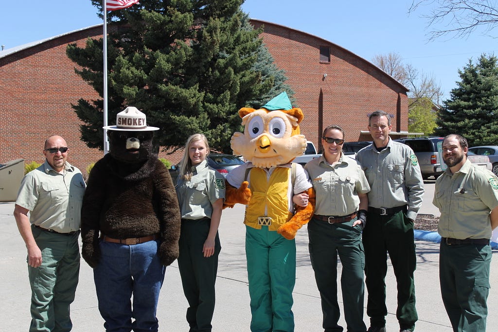 The U.S. Forest Service team at an outreach event; hint: Amanda is dressed in the Woodsy Owl costume. Photo courtesy of Amanda.