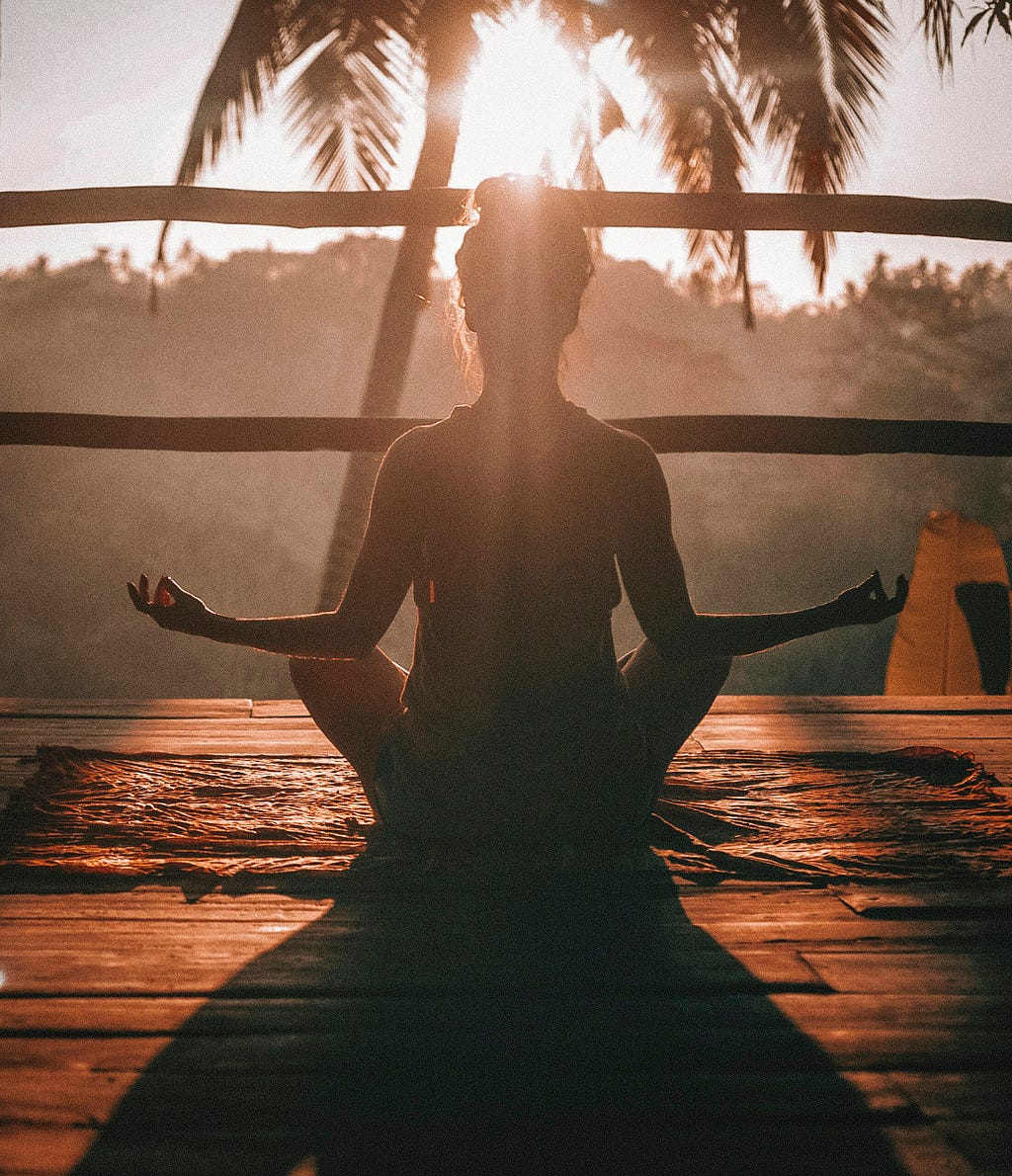 A girl doing meditation in the nature.